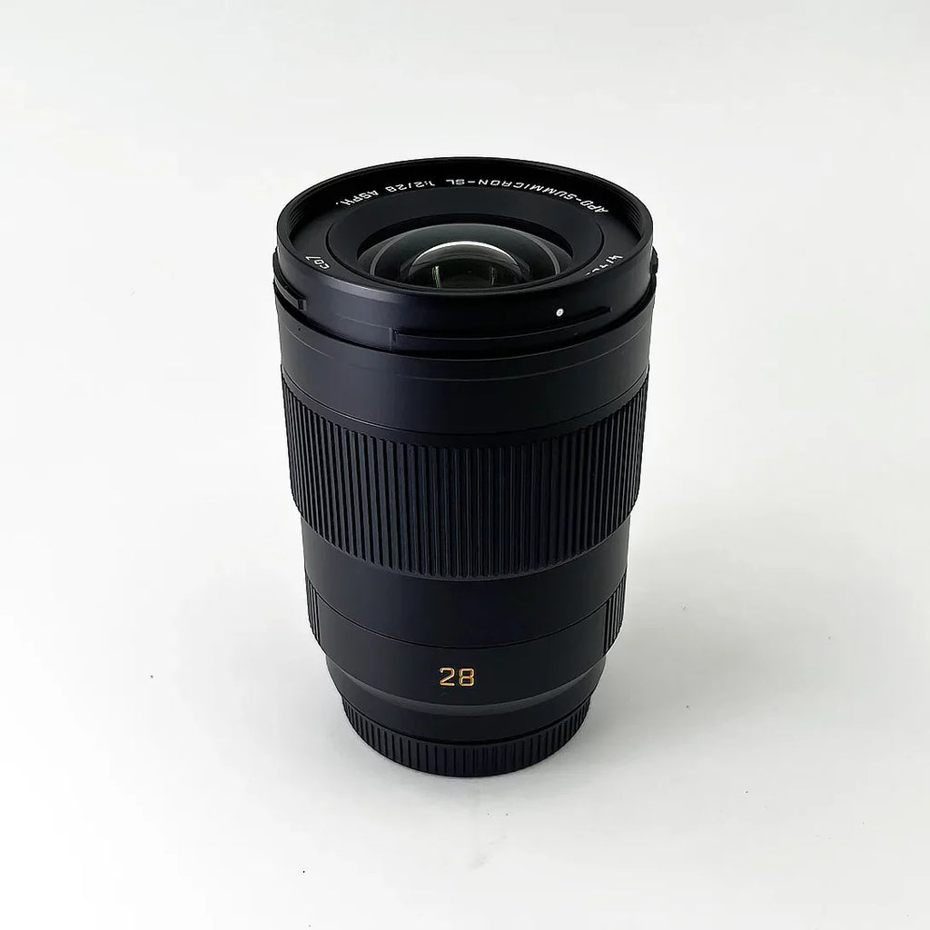 Leica -Summicron- 28mm f/2 Aspherical Lens + Padded Medium Sized Case + 67mm 3-Piece Filter Kit + Lens Cap Keeper + 6Ave Cleaning Kit