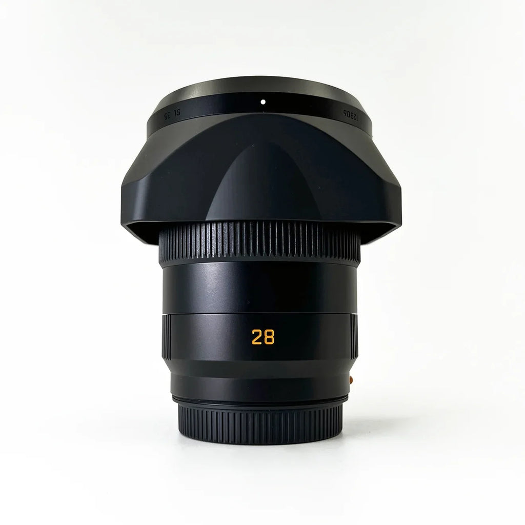 Leica -Summicron- 28mm f/2 Aspherical Lens + Padded Medium Sized Case + 67mm 3-Piece Filter Kit + Lens Cap Keeper + 6Ave Cleaning Kit